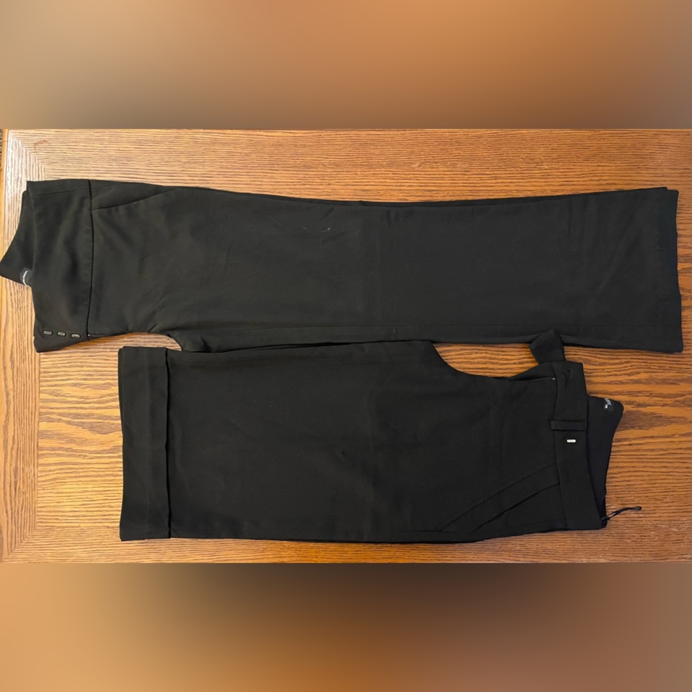 Two pairs of black women’s dress pants